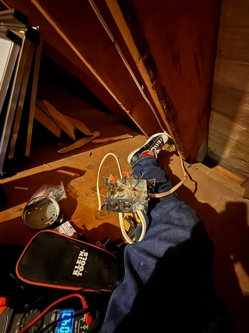 Unsafe open attic electrical junction box with exposed wiring during repair - Hartsdale NY