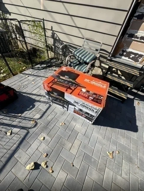 Blackstone griddle boxed on patio before assembly - Bronxville NY