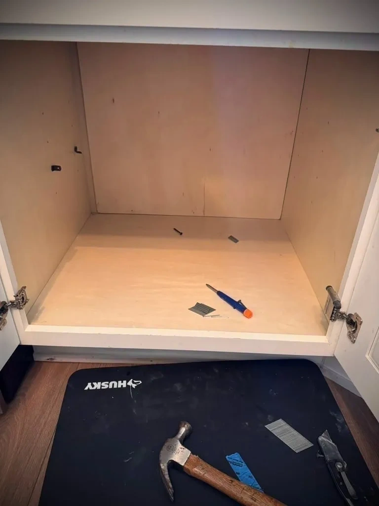Birch plywood backing installed enclosing cabinet wall opening - Scarsdale NY