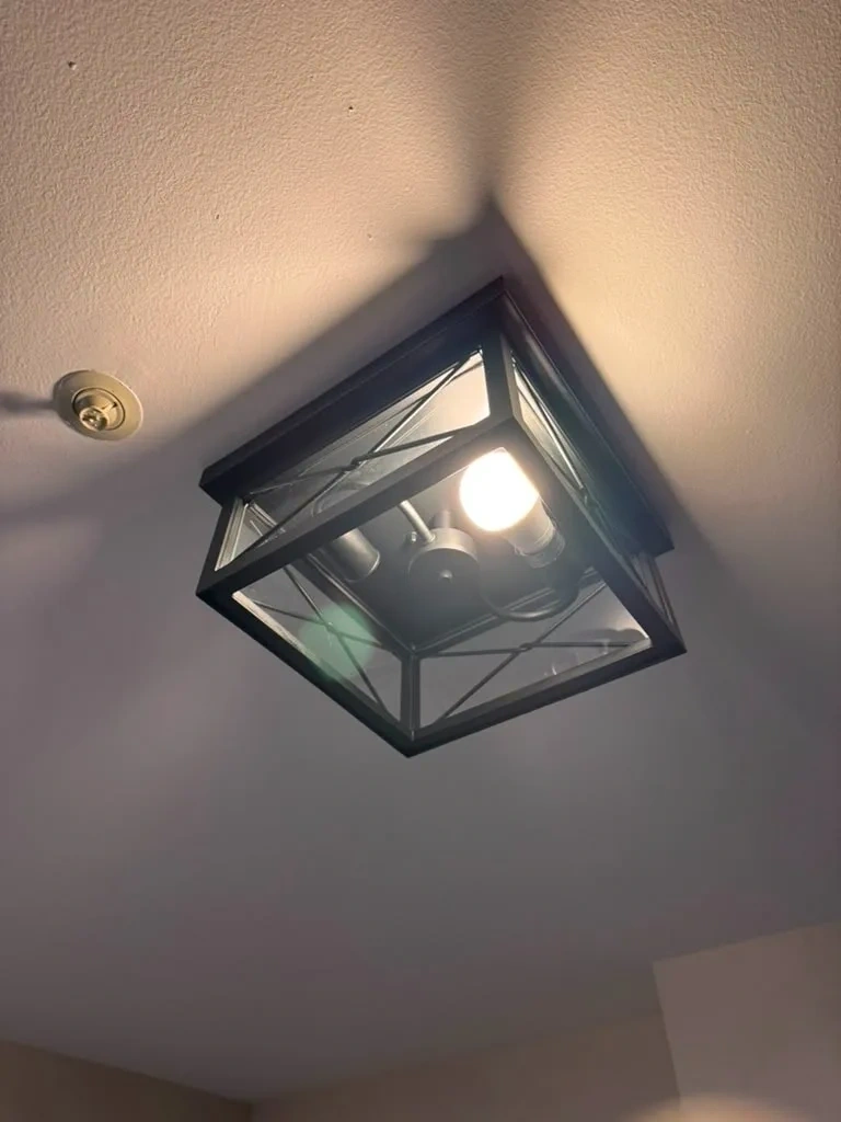 Illuminated modern black metal flush mount ceiling light fixture installed - Tarrytown NY