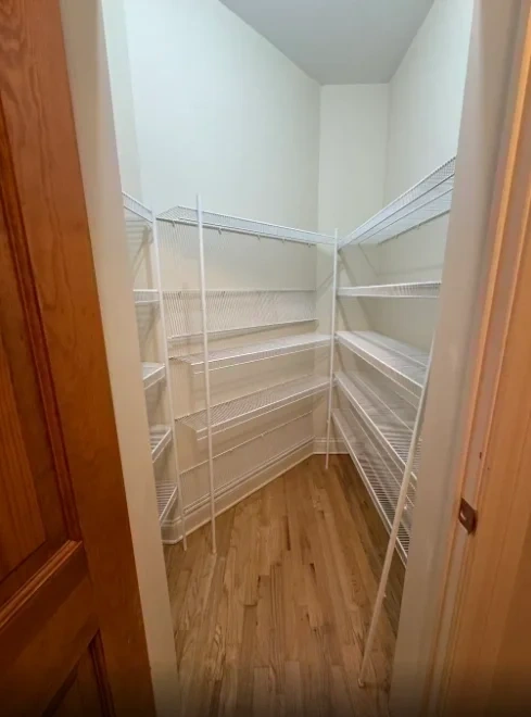 Painted closet with custom white wire shelving installed - Armonk NY