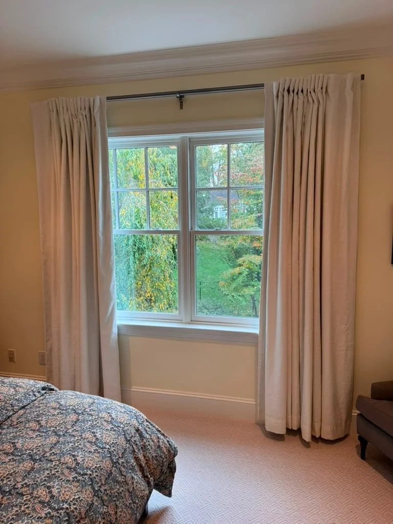 Installed oil-rubbed bronze rod with custom pinch-pleated linen drapes in Scarsdale NY