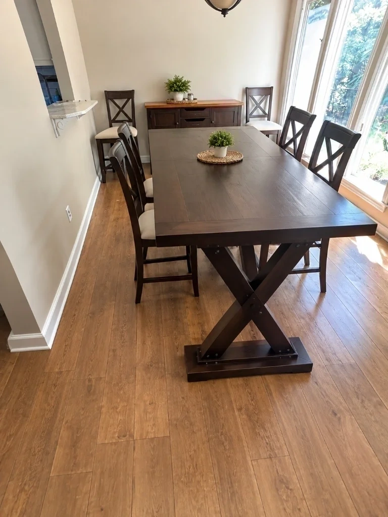 Dark wood dining table and chairs fully assembled and set up in dining room - Purchase NY