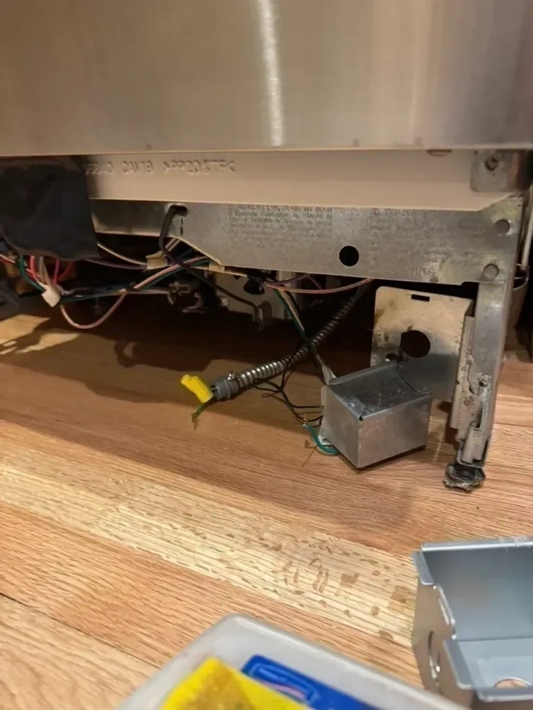 BX armored cable wiring, wire nuts, and junction box electrical connection on stainless dishwasher - New Rochelle NY