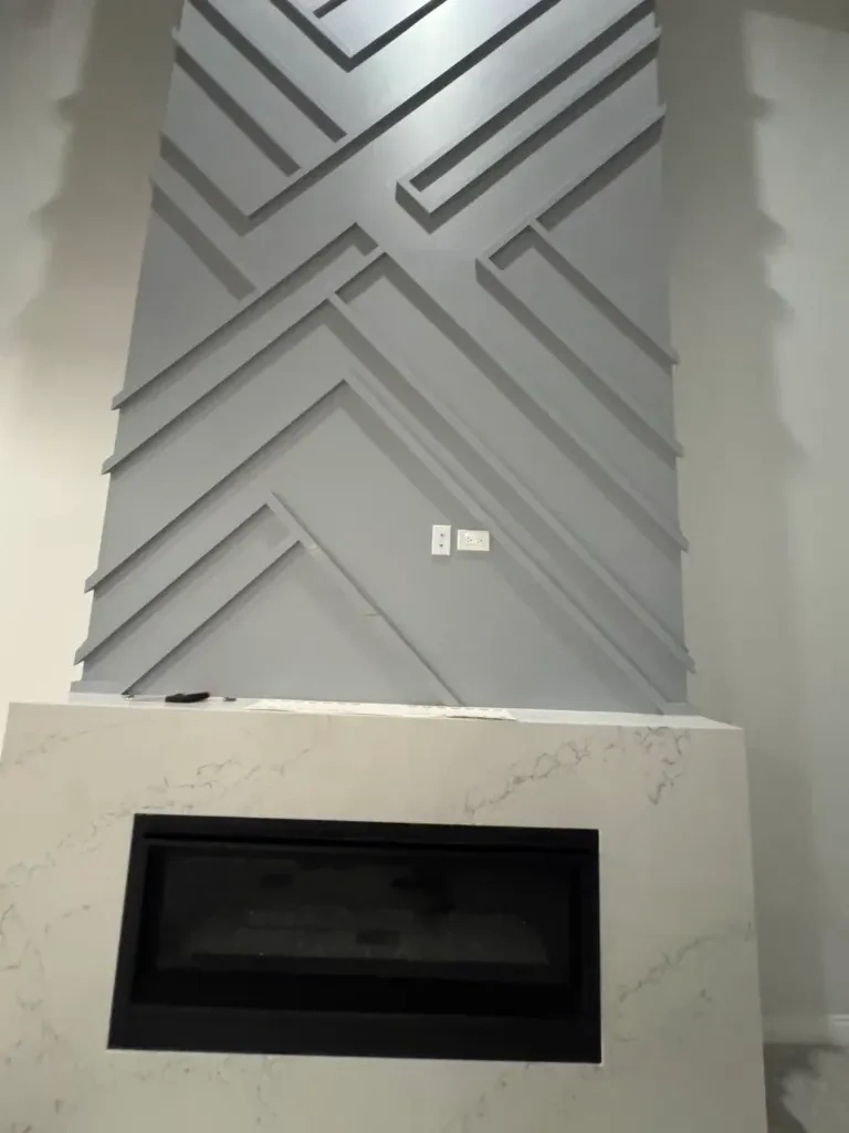 Empty stone wall above fireplace before TV mounting - Scarsdale NY