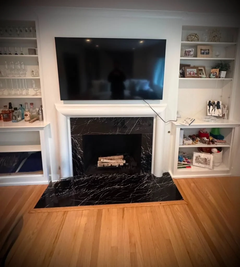 Luxury Fireplace TV Wall Mounting & In-Wall Wire Concealment before repair in Scarsdale, NY (10583)