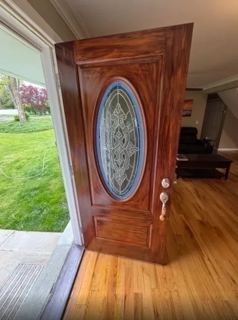 Restored and stained wood front door after refinishing - Rye NY