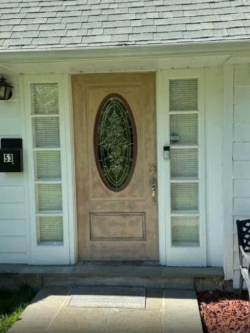 Weathered wood front door before refinishing - Rye NY