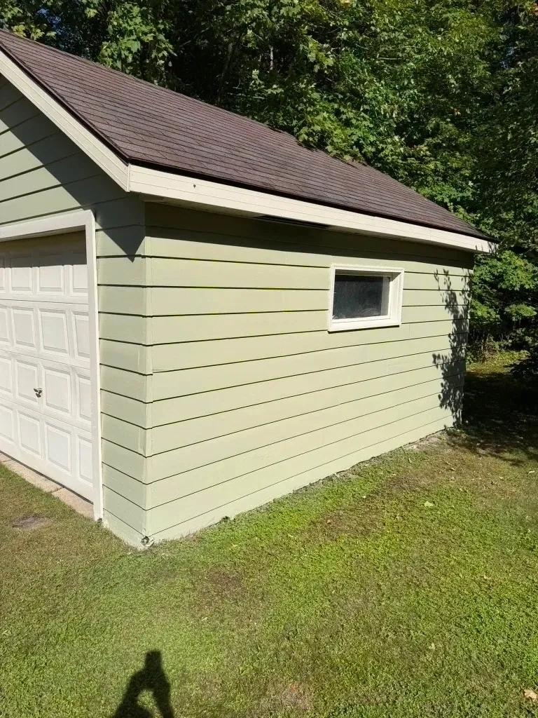 Completed custom exterior painting with 2 coats of durable sage green finish and bright white trim - Mamaroneck NY