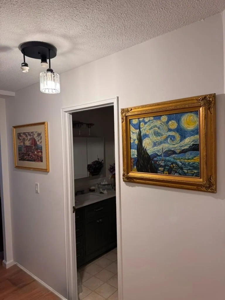 Heavy ornate gold framed artwork mounted level on hallway wall studs - Scarsdale NY