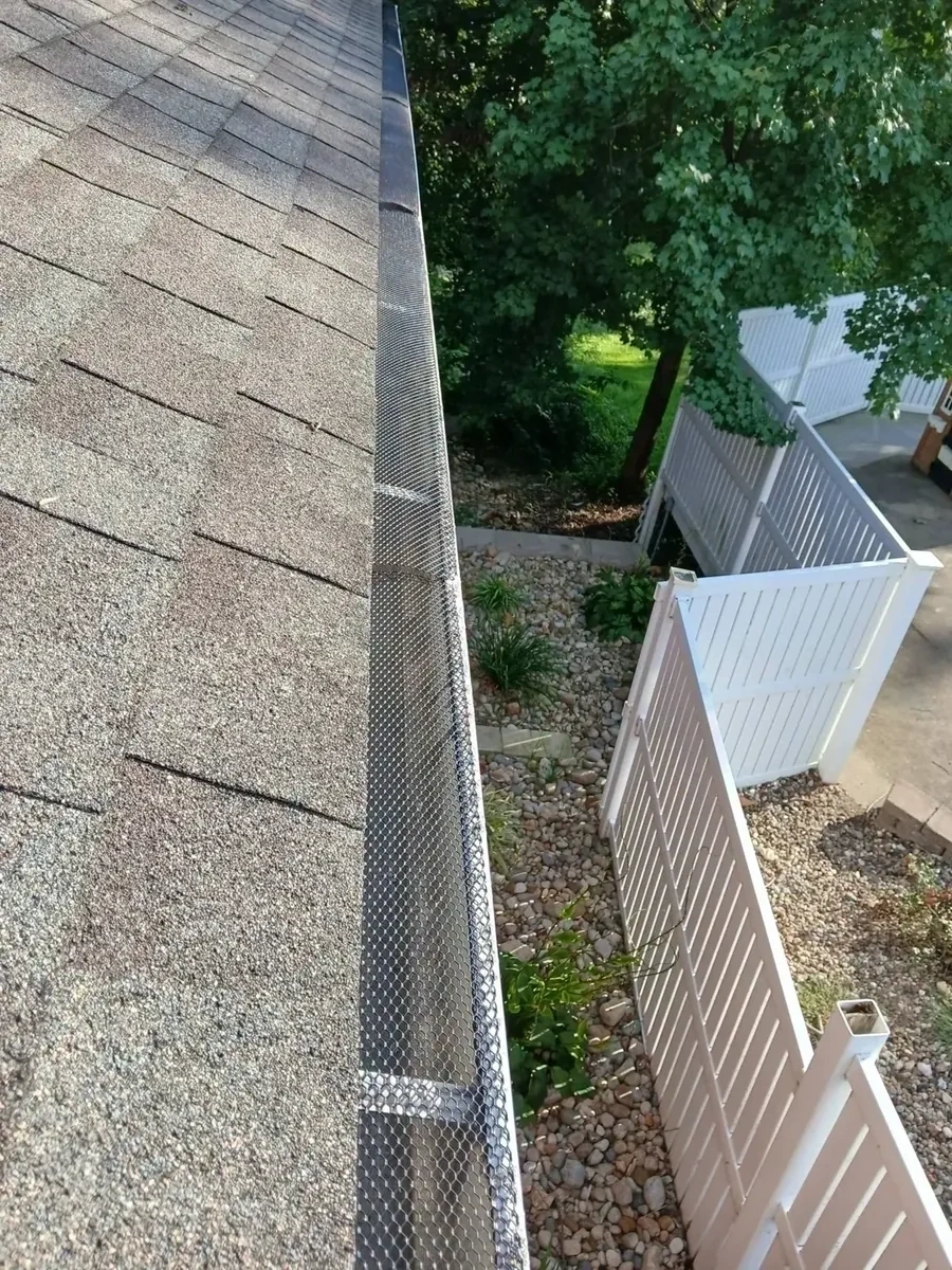 Stainless steel micro-mesh leaf filter gutter guards installed along roofline - Hartsdale NY