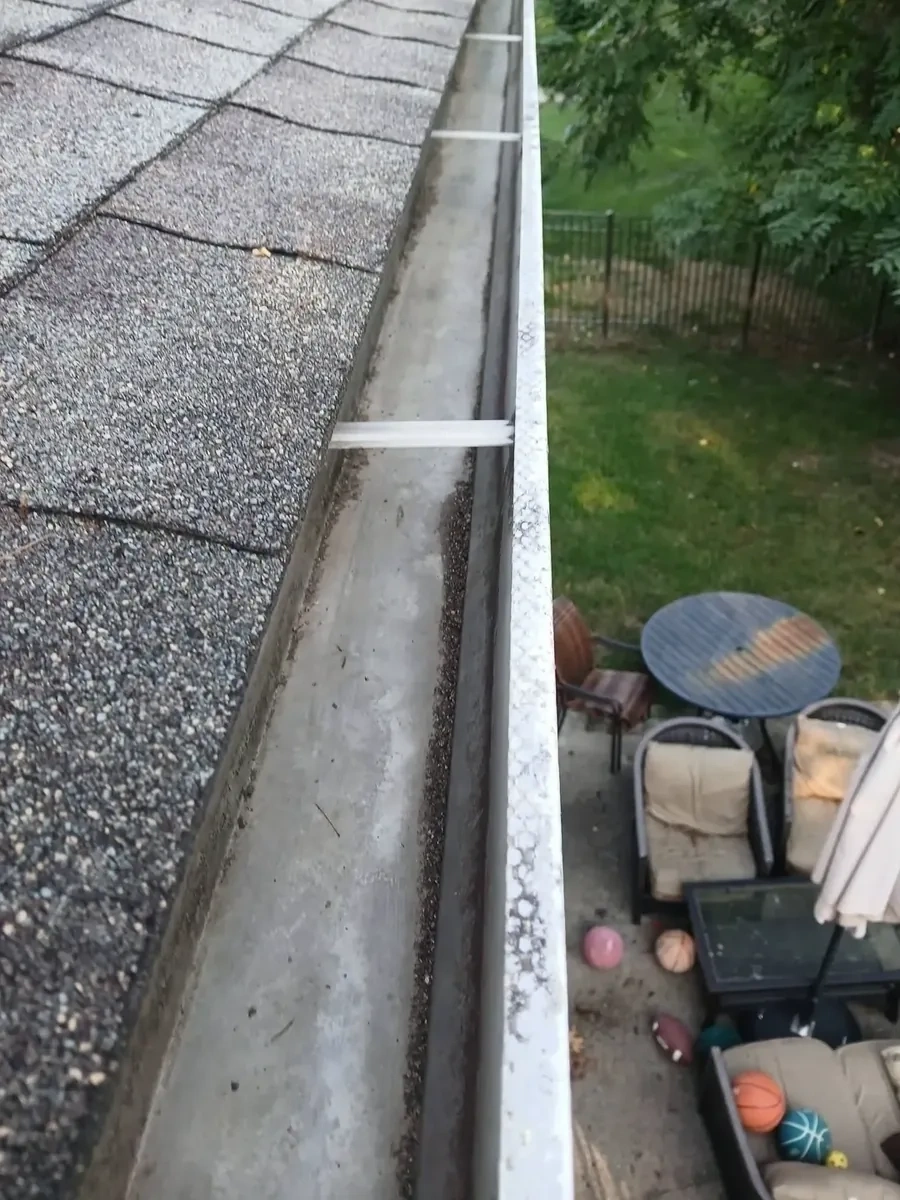 Open roof gutter trough flushed and prepped for leaf filter guards - Hartsdale NY