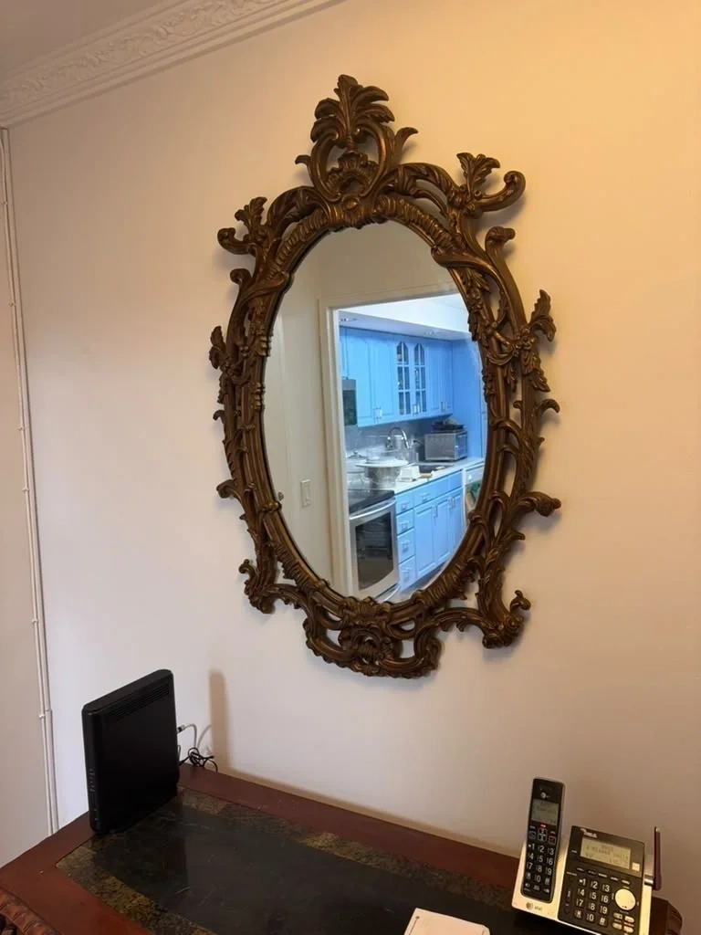 Heavy antique ornate framed mirror securely wall-mounted above desk console - Purchase NY