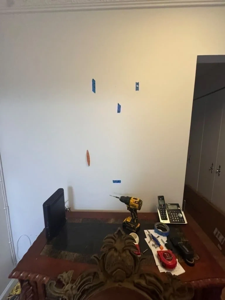 Drywall prepped and laser level marked for heavy ornate mirror hanging - Purchase NY
