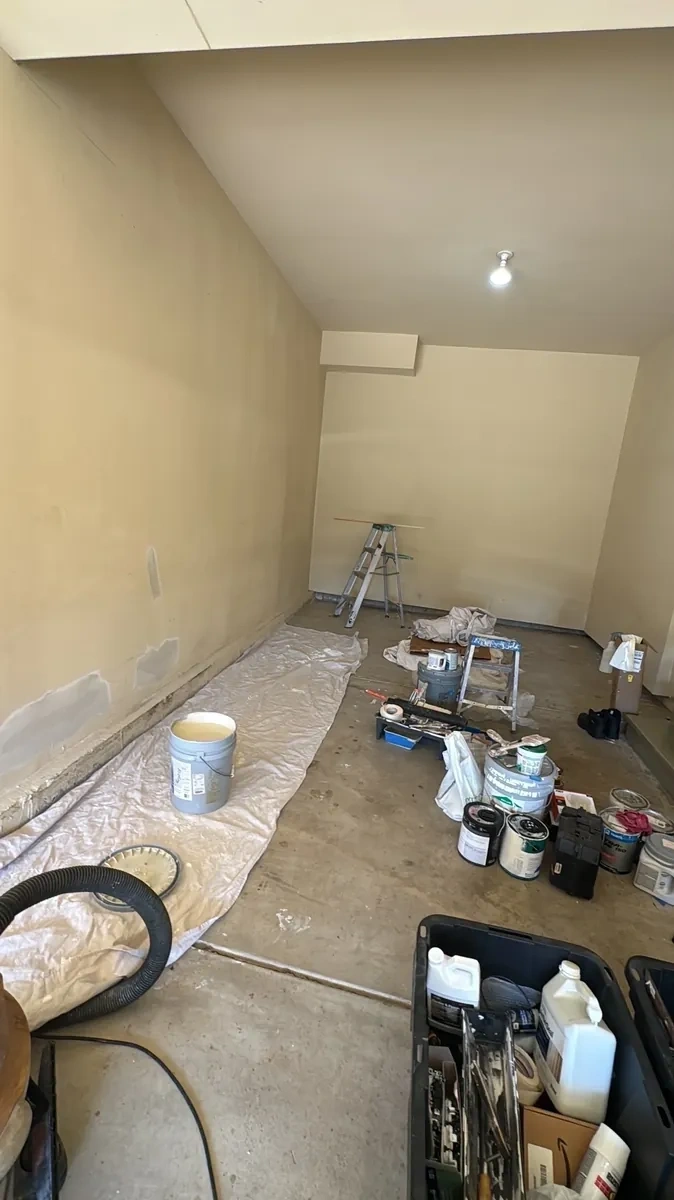 Cluttered garage before organization