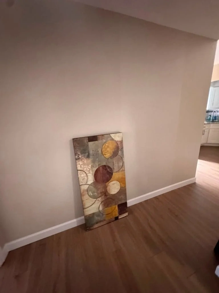 Canvas artwork leaning against wall before hanging - Scarsdale NY