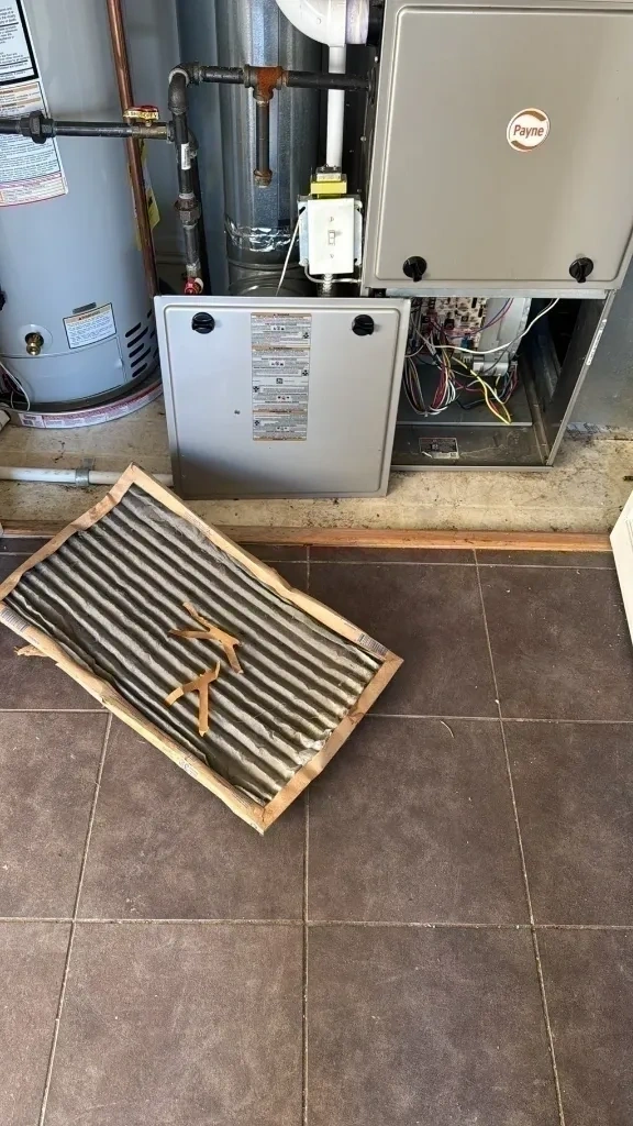 Dirty HVAC air filter removed from furnace unit - Harrison NY