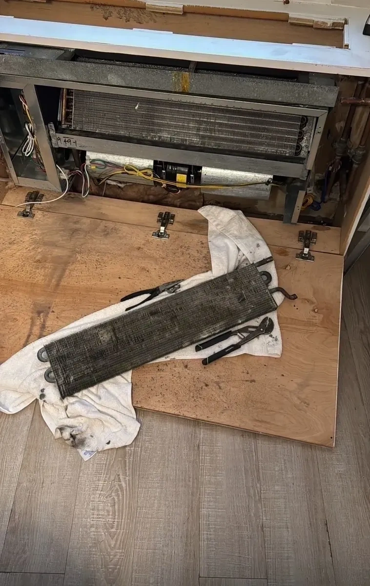 Old dirty HVAC evaporator coil removed from cabinet enclosure - Mamaroneck NY