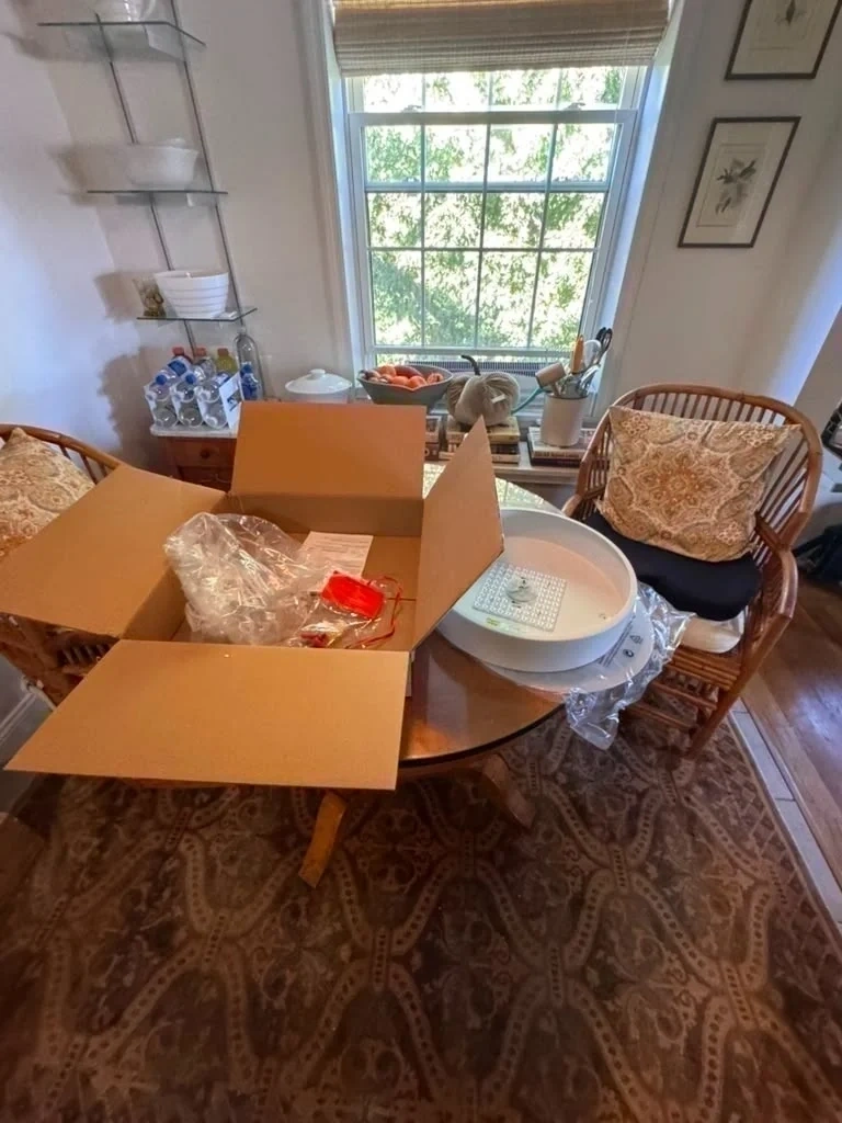 Unboxed modern LED ceiling flush-mount light fixture sitting with box before installation - Rye NY