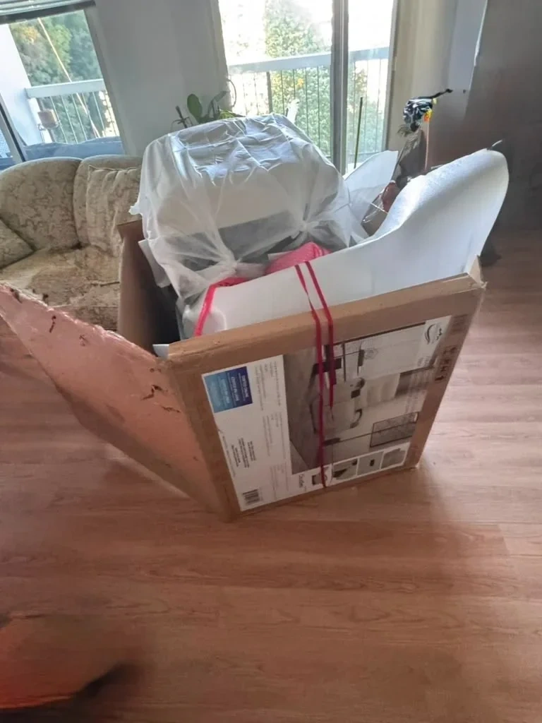 Flat pack power recliner armchair parts and box unboxed in living room - Rye NY