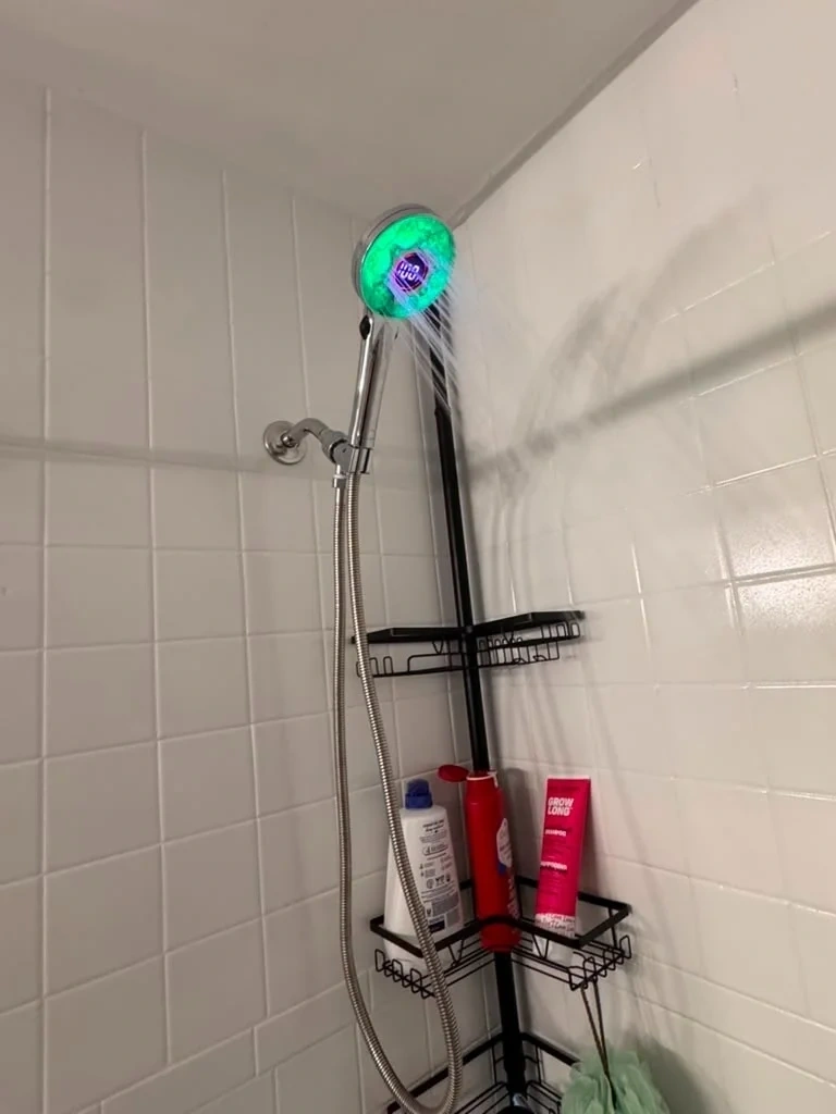 Handheld LED digital display showerhead spraying water - Rye NY