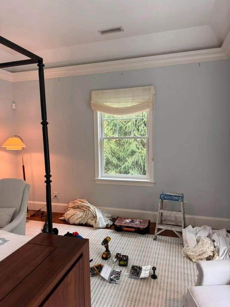 Master bedroom drapery rod bracket layout and tool staging in Bedford NY