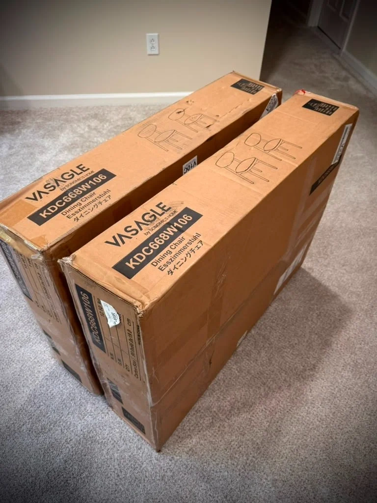 Flat-pack dining chair delivery boxes before assembly in Rye NY