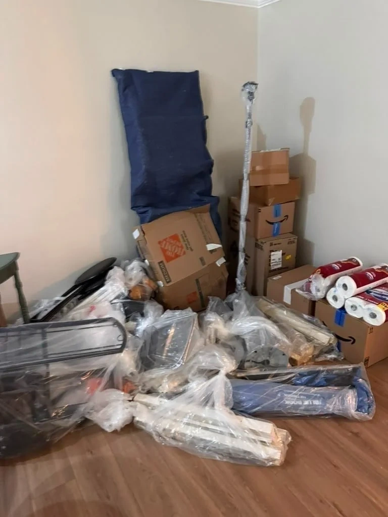 Mold-contaminated household items isolated and bagged inside home before cleanout - Mamaroneck NY