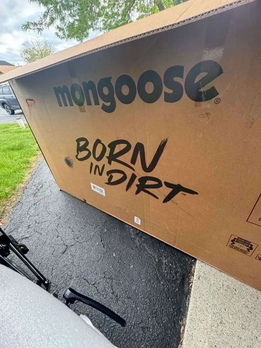 Mongoose mountain bike sealed box on driveway before assembly - Pleasantville NY