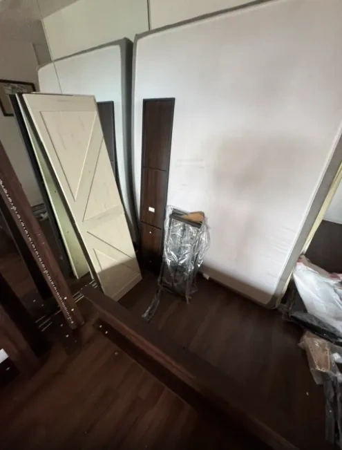 Unassembled Murphy bed parts and panels before assembly - Scarsdale NY