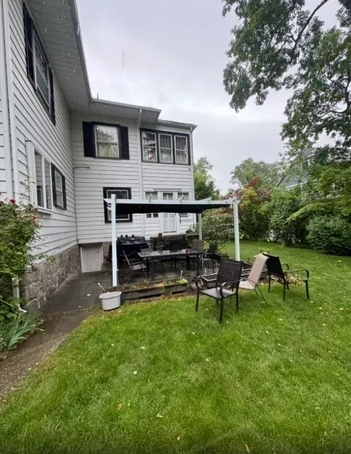White outdoor pergola fully built in backyard patio - Chappaqua NY