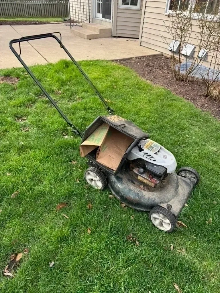 Lawn mower prepped with leaf collection bags for estate grounds maintenance - Pleasantville NY