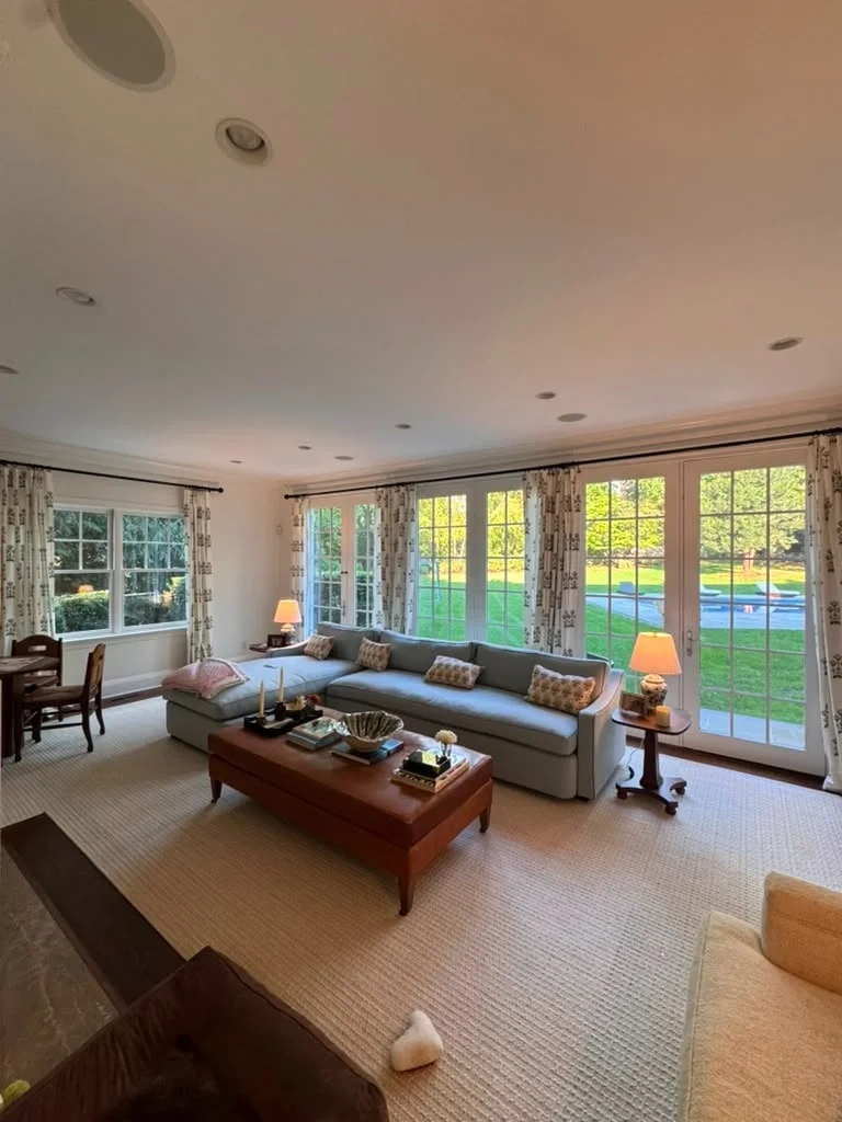 Completed custom botanical linen drapery and iron rods on sunroom French doors in Armonk NY