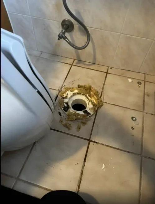 Old worn wax ring removed from toilet floor flange - Scarsdale NY