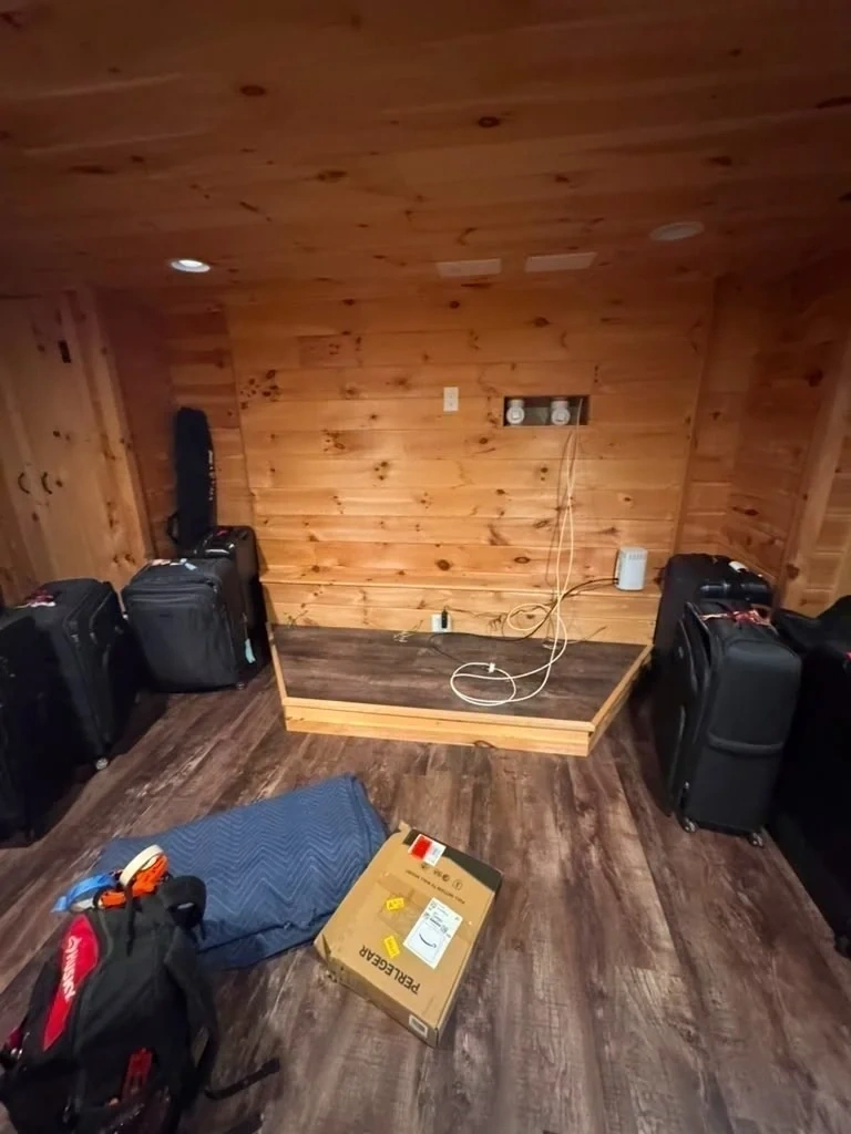 Wood panel wall prep and exposed power cables before TV mounting - Ardsley NY